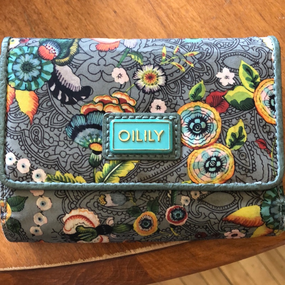 Oilily wallet . Green with paisley and colourful flowers it’s been gently use